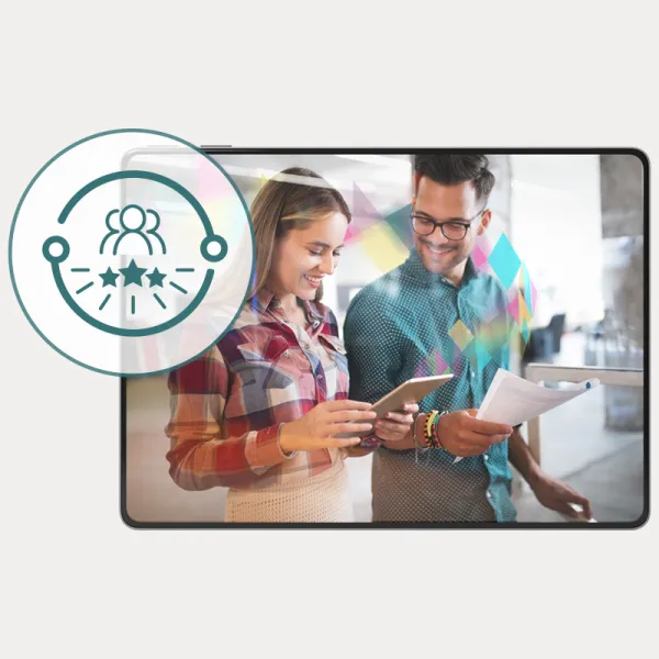 Two colleagues sharing an Omnia update on a tablet