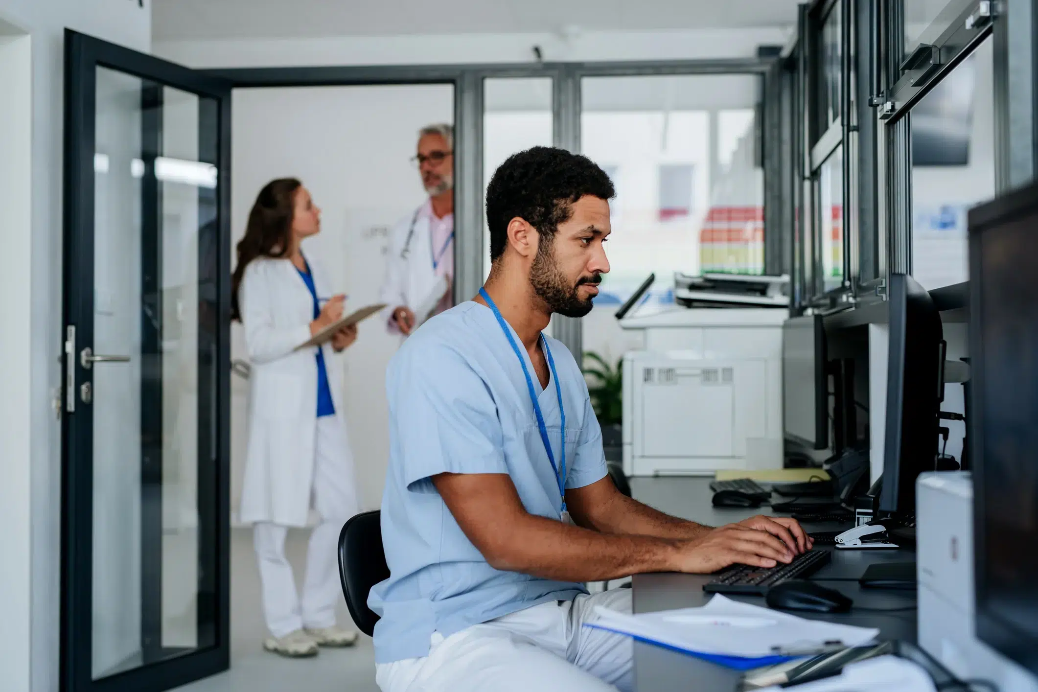 Team reviewing governed Microsoft 365 workspace structure